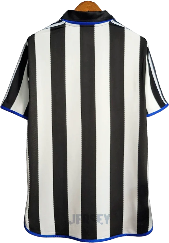 Camiseta New Castle 2000 01 local reverso